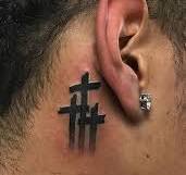 cross behind the ear tattoos